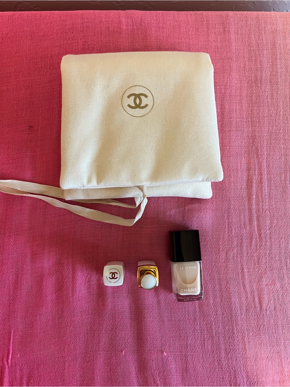 CHANEL Neutral Nail Polish & Branded Bag with Lipstick.